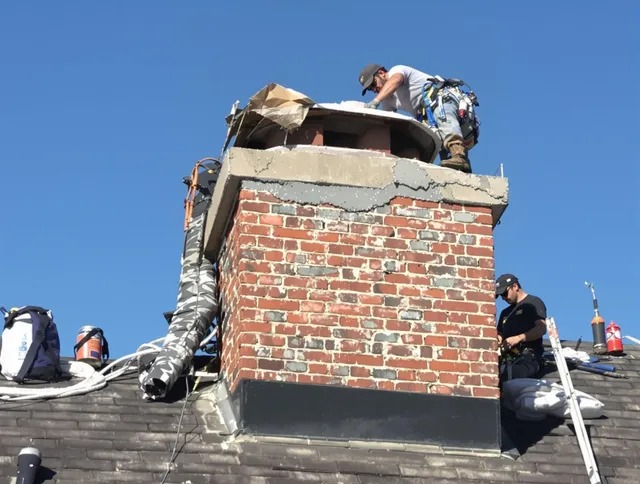Hinesville Chimney Sweep installing a custom chimney crown in Hinesville, GA