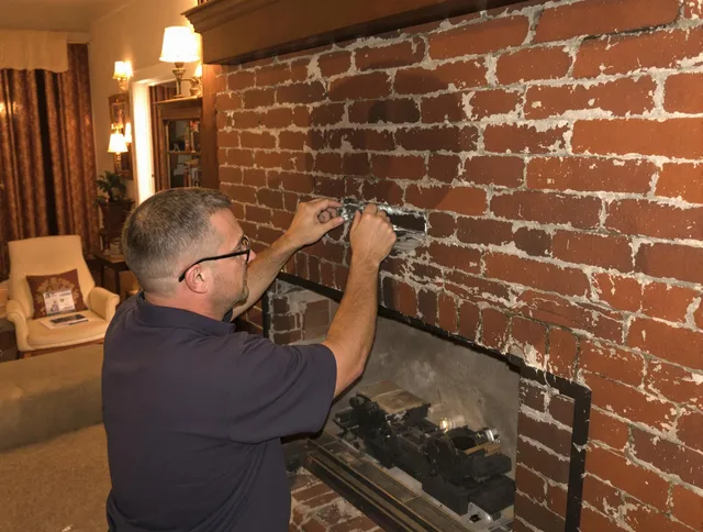 Hinesville Chimney Sweep expert fixing a fireplace in Hinesville, GA